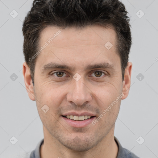 Joyful white adult male with short  brown hair and brown eyes