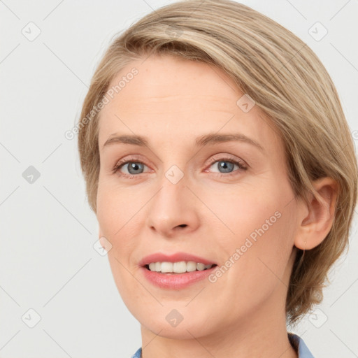 Joyful white young-adult female with medium  brown hair and blue eyes