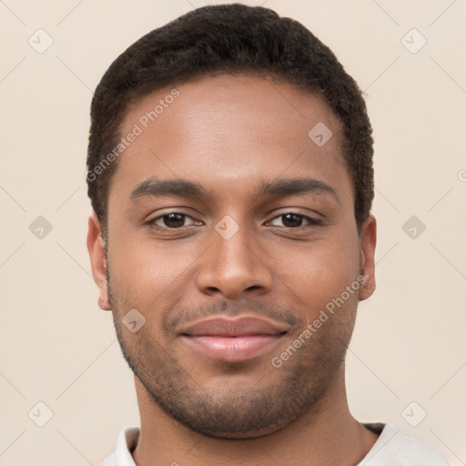 Joyful black young-adult male with short  brown hair and brown eyes