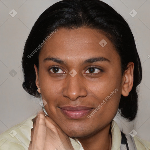 Joyful latino young-adult female with medium  brown hair and brown eyes