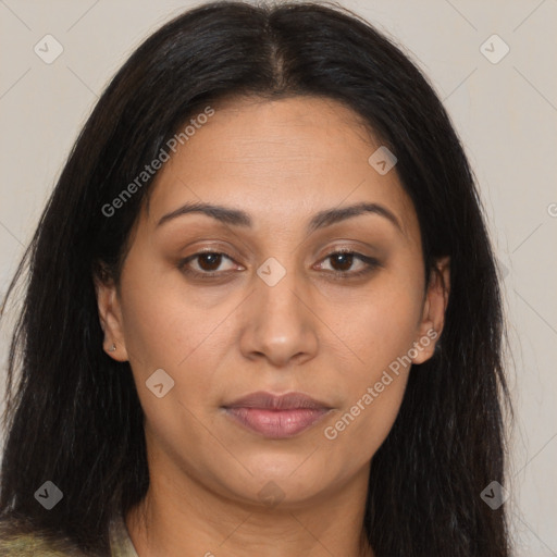 Joyful latino adult female with long  brown hair and brown eyes