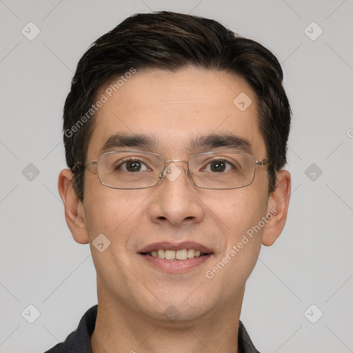 Joyful white young-adult male with short  black hair and brown eyes