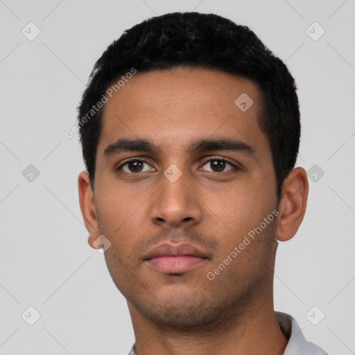 Neutral latino young-adult male with short  black hair and brown eyes