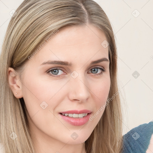 Joyful white young-adult female with long  brown hair and blue eyes