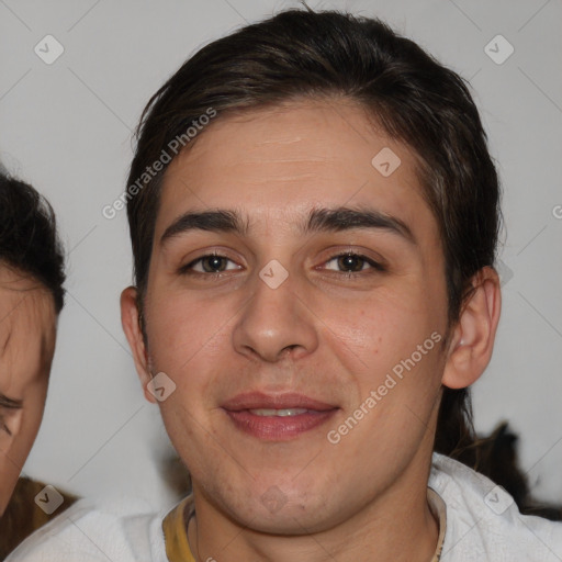 Joyful white young-adult male with short  brown hair and brown eyes