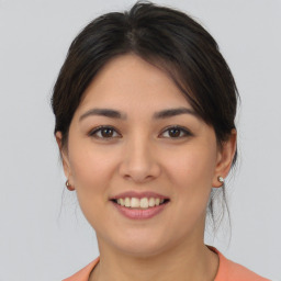 Joyful asian young-adult female with medium  brown hair and brown eyes