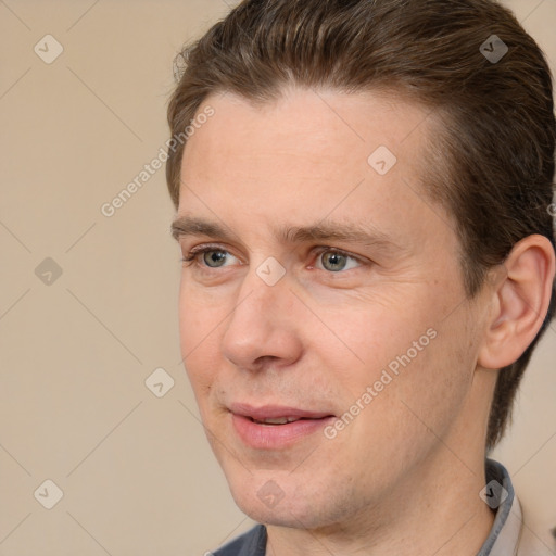 Joyful white adult male with short  brown hair and brown eyes