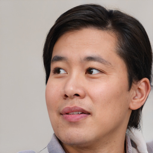 Neutral asian young-adult male with short  brown hair and brown eyes