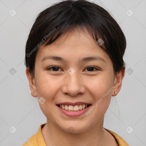 Joyful asian young-adult female with short  brown hair and brown eyes