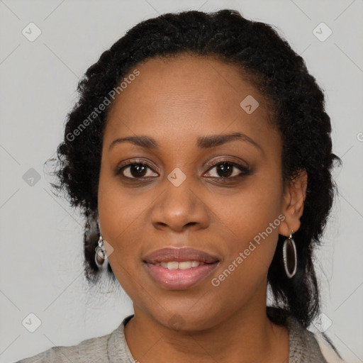 Joyful black young-adult female with medium  black hair and brown eyes