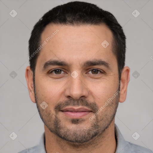 Joyful white young-adult male with short  black hair and brown eyes