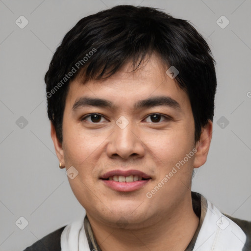 Joyful white young-adult male with short  black hair and brown eyes