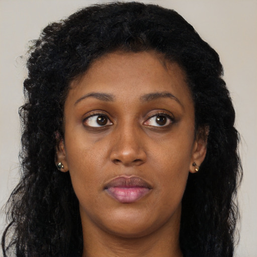 Neutral black young-adult female with long  black hair and brown eyes
