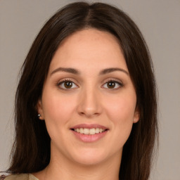 Joyful white young-adult female with medium  brown hair and brown eyes