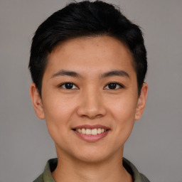 Joyful asian young-adult female with short  black hair and brown eyes