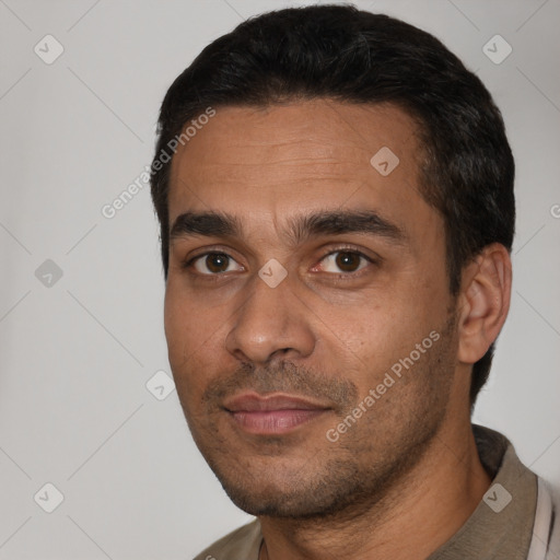 Neutral white young-adult male with short  black hair and brown eyes