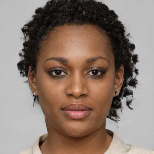 Neutral black young-adult female with short  brown hair and brown eyes