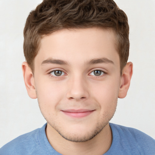 Joyful white child male with short  brown hair and brown eyes