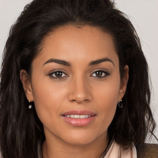 Joyful white young-adult female with long  brown hair and brown eyes