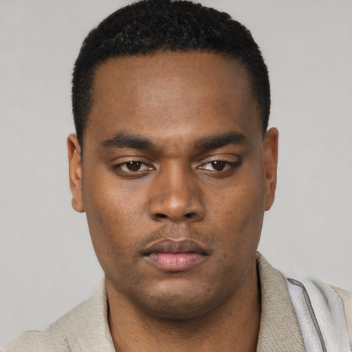 Neutral black young-adult male with short  black hair and brown eyes