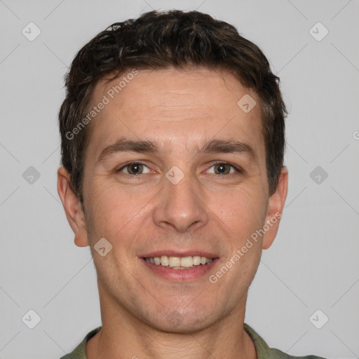 Joyful white adult male with short  brown hair and brown eyes