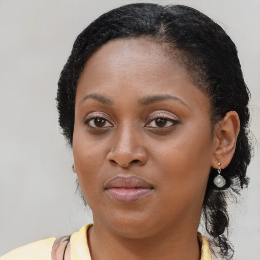 Neutral black young-adult female with medium  black hair and brown eyes