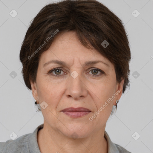 Joyful white adult female with medium  brown hair and grey eyes