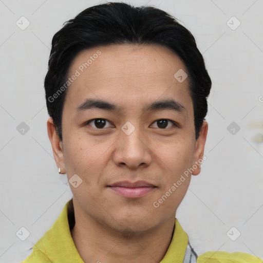 Joyful asian young-adult male with short  black hair and brown eyes