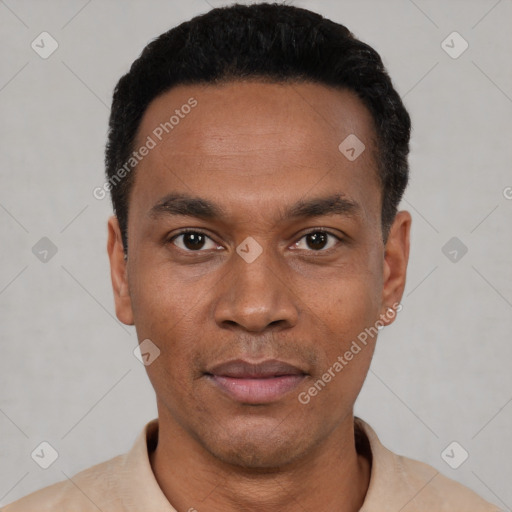 Joyful black young-adult male with short  black hair and brown eyes