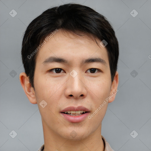 Joyful asian young-adult male with short  brown hair and brown eyes