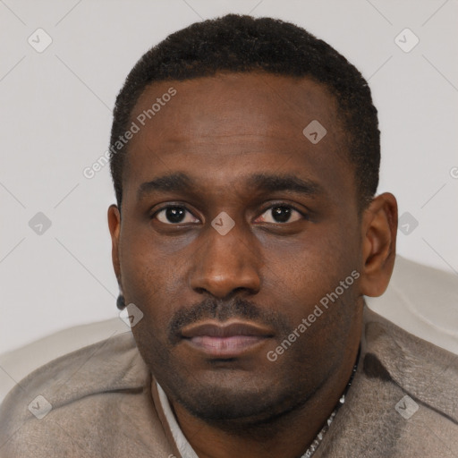 Neutral black young-adult male with short  black hair and brown eyes