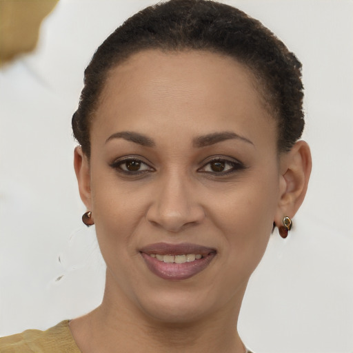 Joyful latino young-adult female with short  brown hair and brown eyes