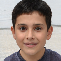 Joyful white child male with short  brown hair and brown eyes