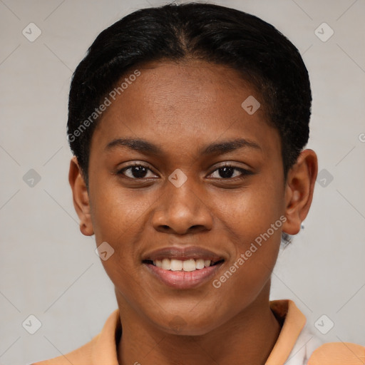 Joyful black young-adult female with short  brown hair and brown eyes