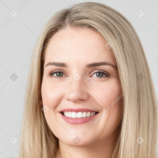 Joyful white young-adult female with long  brown hair and brown eyes