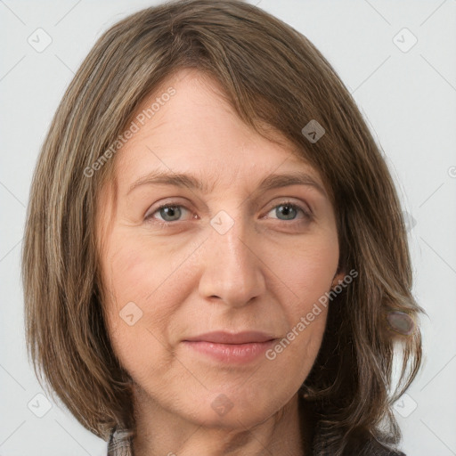 Joyful white adult female with medium  brown hair and grey eyes