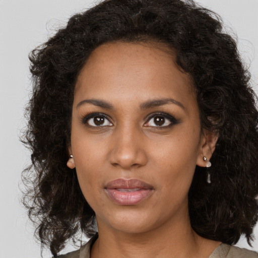 Neutral black young-adult female with long  brown hair and brown eyes