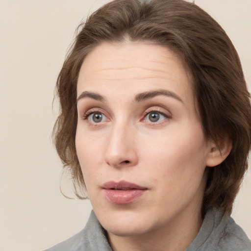 Neutral white young-adult female with medium  brown hair and grey eyes