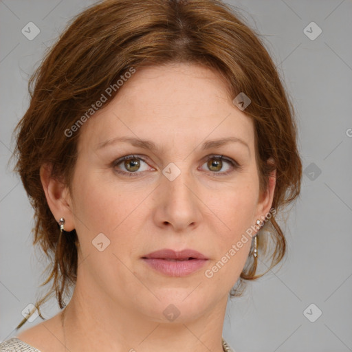 Joyful white adult female with medium  brown hair and blue eyes