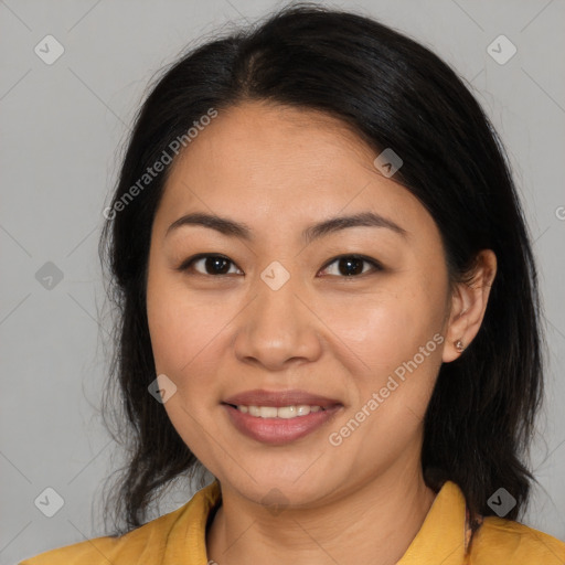 Joyful asian young-adult female with long  brown hair and brown eyes