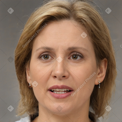 Joyful white adult female with medium  brown hair and brown eyes