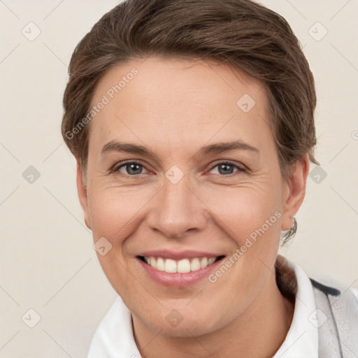 Joyful white young-adult female with short  brown hair and grey eyes