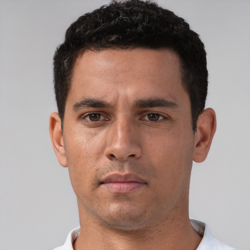 Neutral white young-adult male with short  black hair and brown eyes