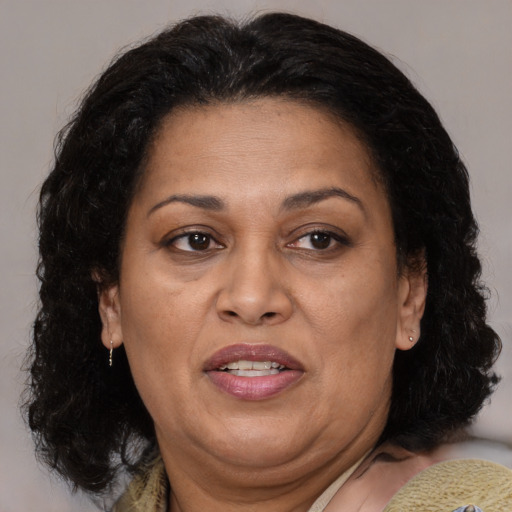 Joyful white adult female with medium  brown hair and brown eyes
