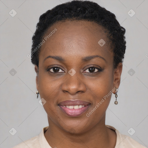 Joyful black young-adult female with short  black hair and brown eyes