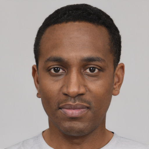 Neutral black young-adult male with short  black hair and brown eyes