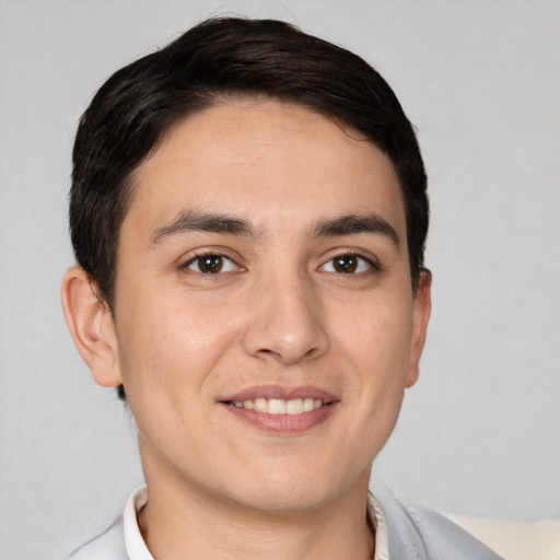 Joyful white young-adult male with short  brown hair and brown eyes