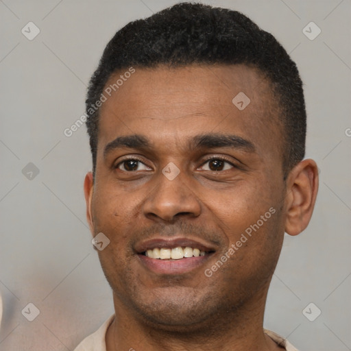 Joyful black young-adult male with short  black hair and brown eyes