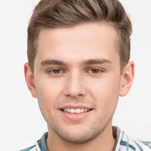 Joyful white young-adult male with short  brown hair and brown eyes