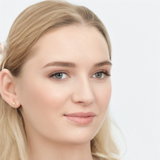 Joyful white young-adult female with long  brown hair and blue eyes